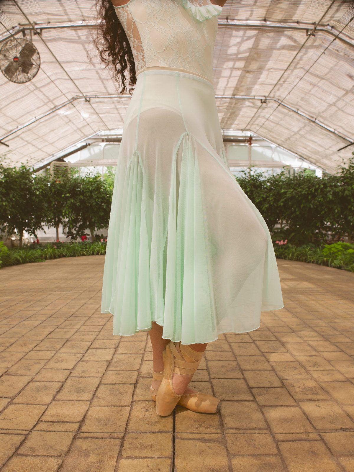 Detail of a mint tulle skirt in motion