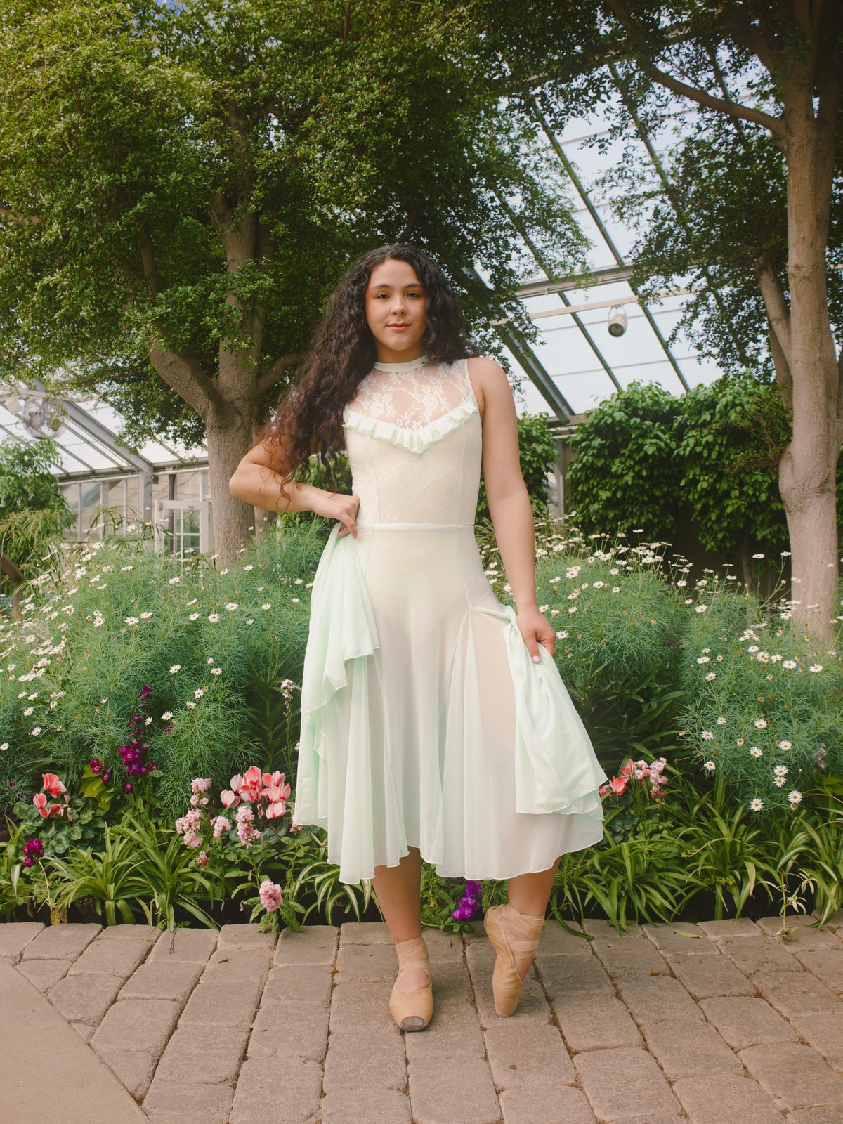Dancer standing in a garden path