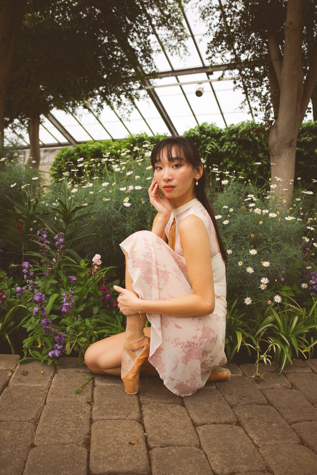 Dancer kneeling with a flower