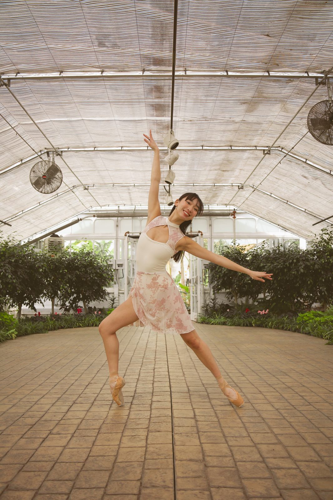 Dancer leaping in a floral dress