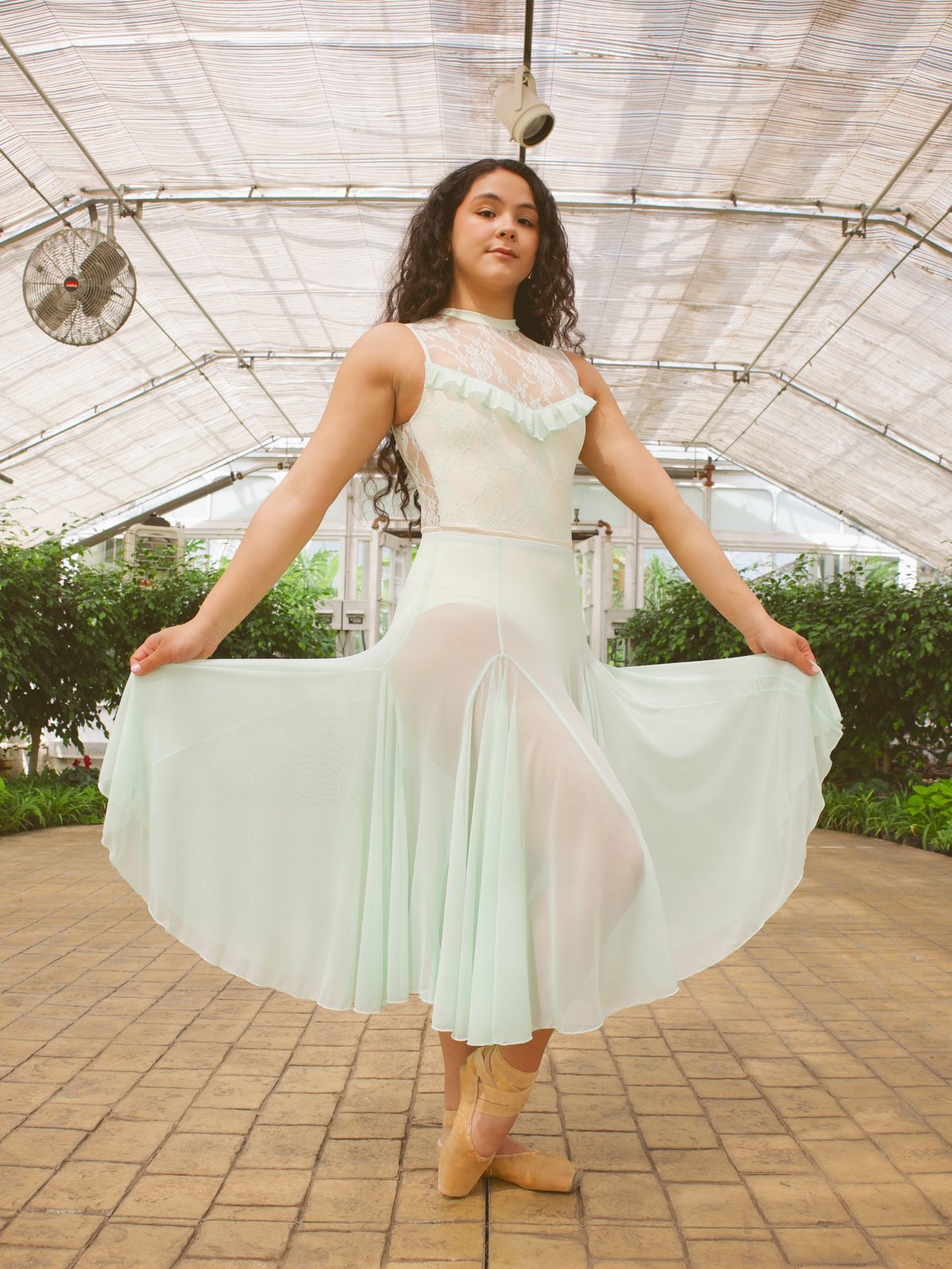 Dancer fanning a mint tulle skirt